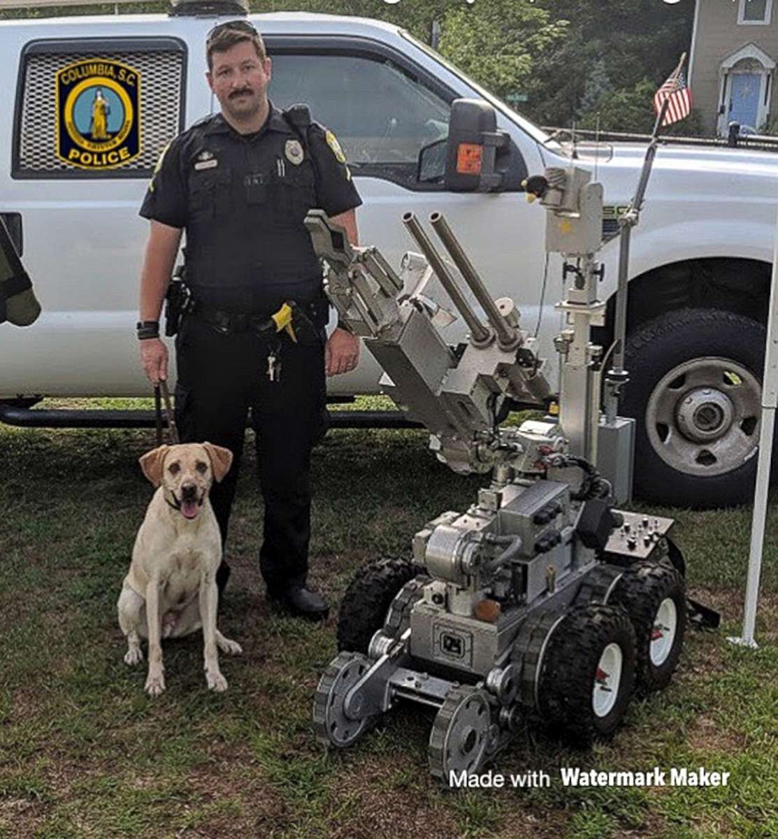 In this undated photo released by the Columbia, S.C., Police Department, Master Police Officer David Hurt is seen with his police dog "Turbo."