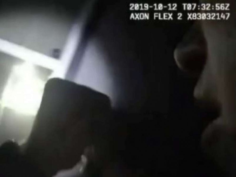 PHOTO: A police officer is seen in bodycam footage shining a flashlight moments before shooting into a window, striking a woman and killing her.