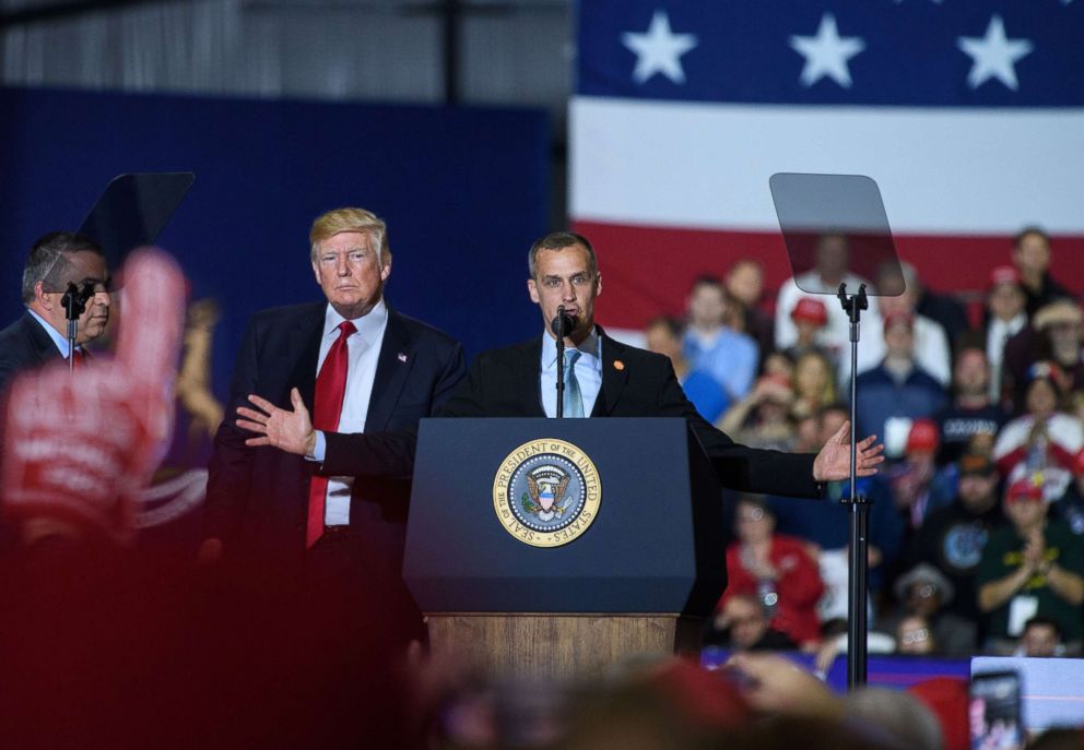 PHOTO: Former Trump Campaign manager Corey Lewandowski speaks as US President Donald Trump looks on during a rally at Total Sports Park in Washington, Michigan, April 28, 2018.