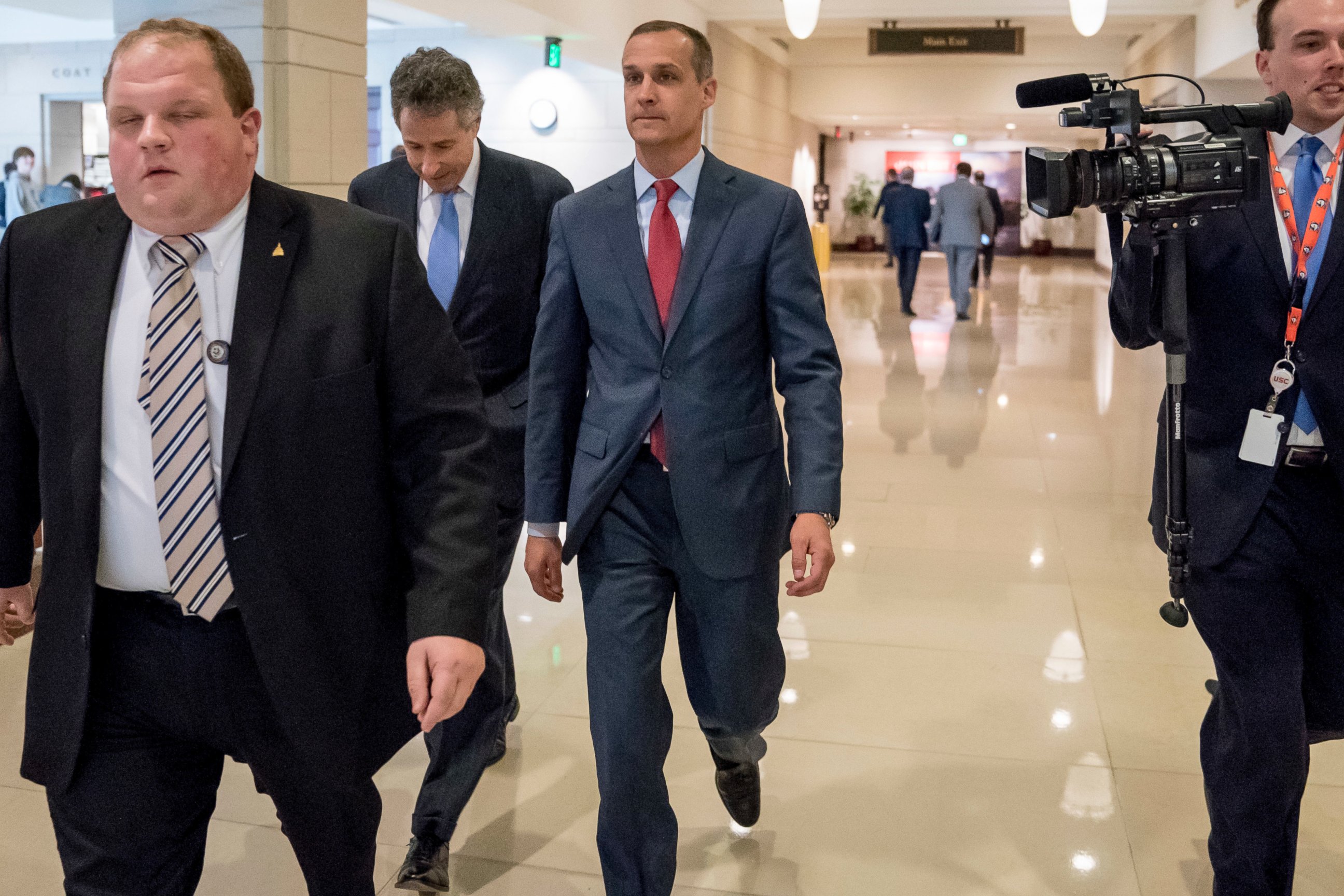 Former Trump campaign manager Cory Lewandowski, center, and his lawyer Peter Chavkin, second from left, arrive to meet behind closed doors with the House Intelligence Committee, at the Capitol in Washington, Thursday, March 8, 2018.