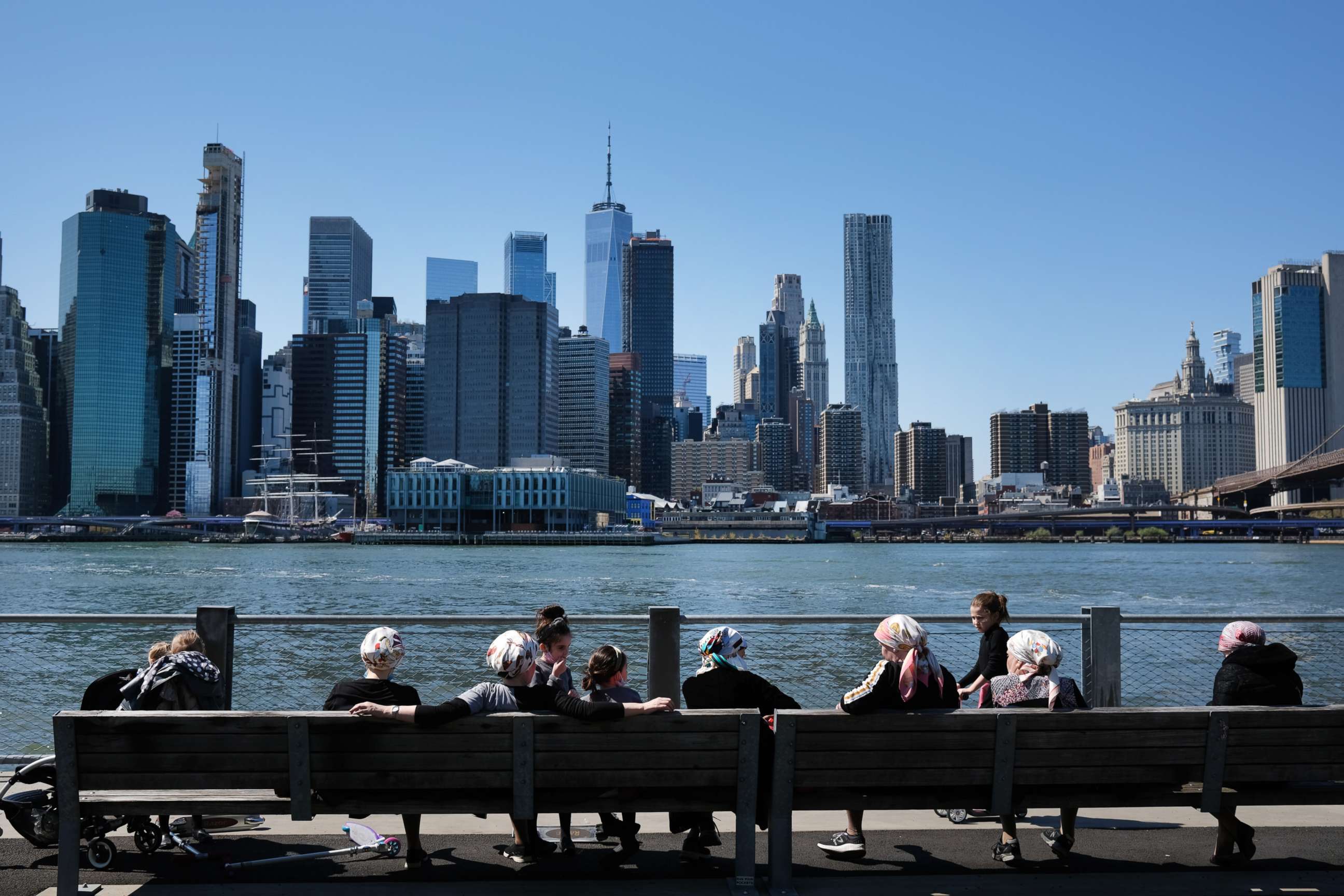 PHOTO: People enjoy a spring afternoon in Brooklyn Bridge Park on April 28, 2020, in the Brooklyn borough of New York.