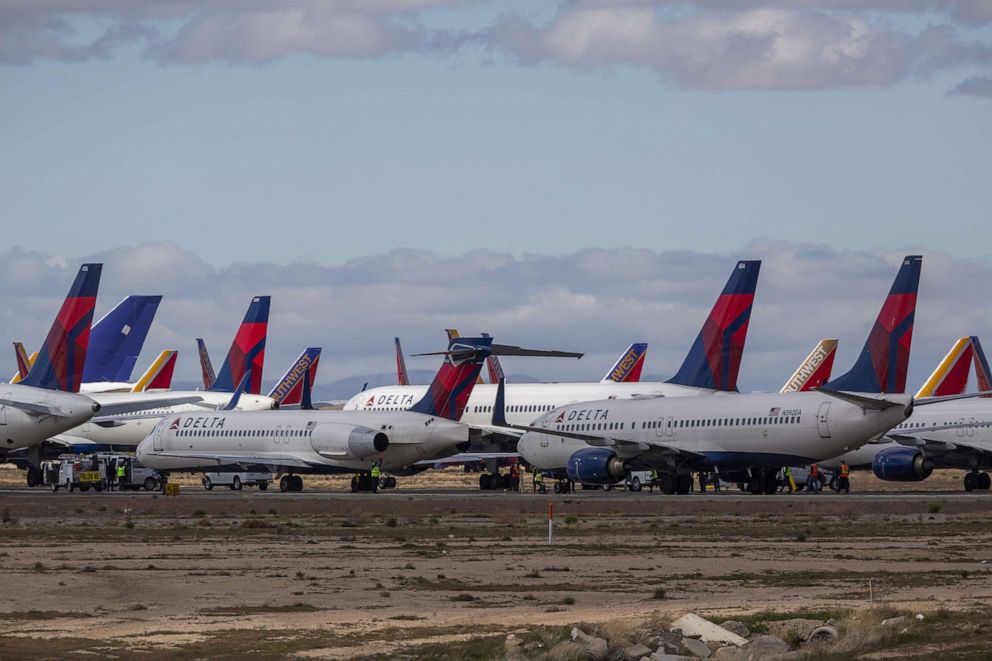 PHOTO: Delta Air Lines jets are parked in growing numbers at Southern California Logistics Airport on March 24, 2020, in Victorville, Calif.