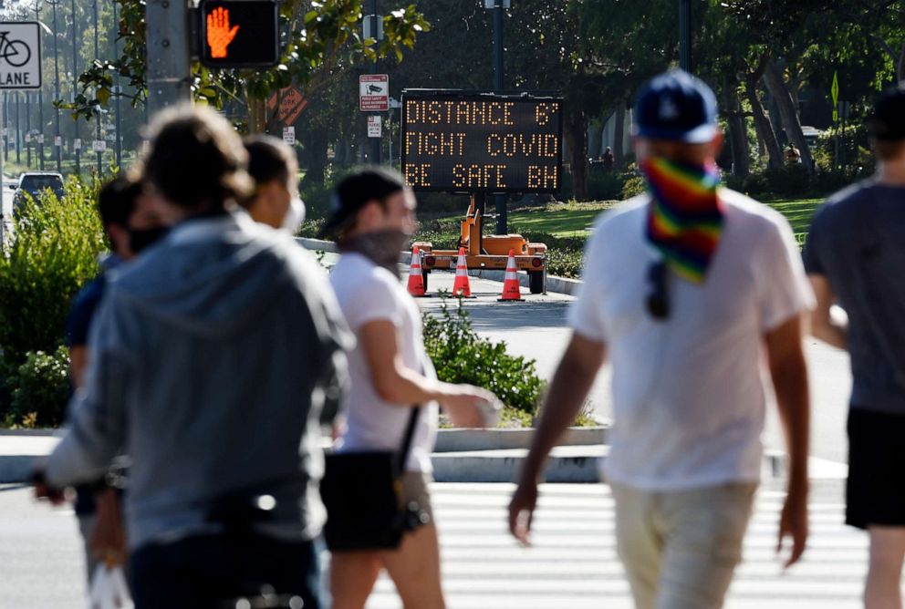 PHOTO: An electronic sign on Santa Monica Boulevard reminds drivers and pedestrians to maintain six feet of social distance to limit the spread of the coronavirus, April 16, 2020, in Beverly Hills, Calif.