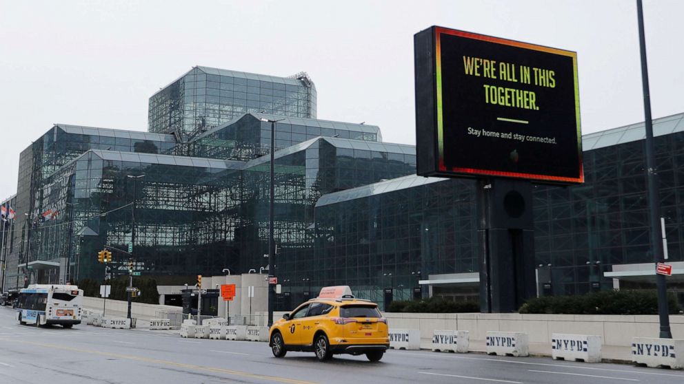 PHOTO: Cars pass the Jacob Javits Convention Center Friday, April 3, 2020, in New York.