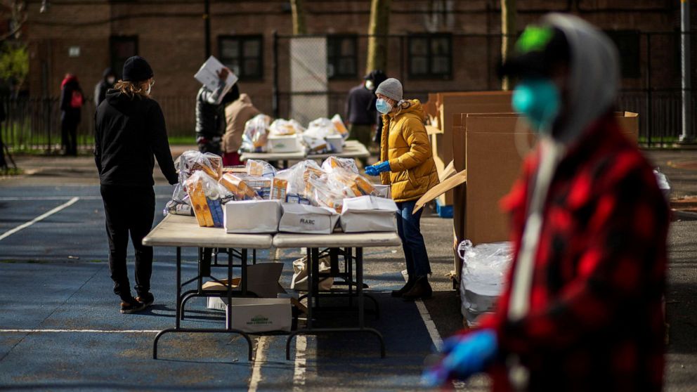 PHOTO: Workers organize food to be donated by City Harvest Mobile Market Food Distribution Center, during the outbreak of the coronavirus disease in the Brooklyn borough of New York, April 15, 2020.