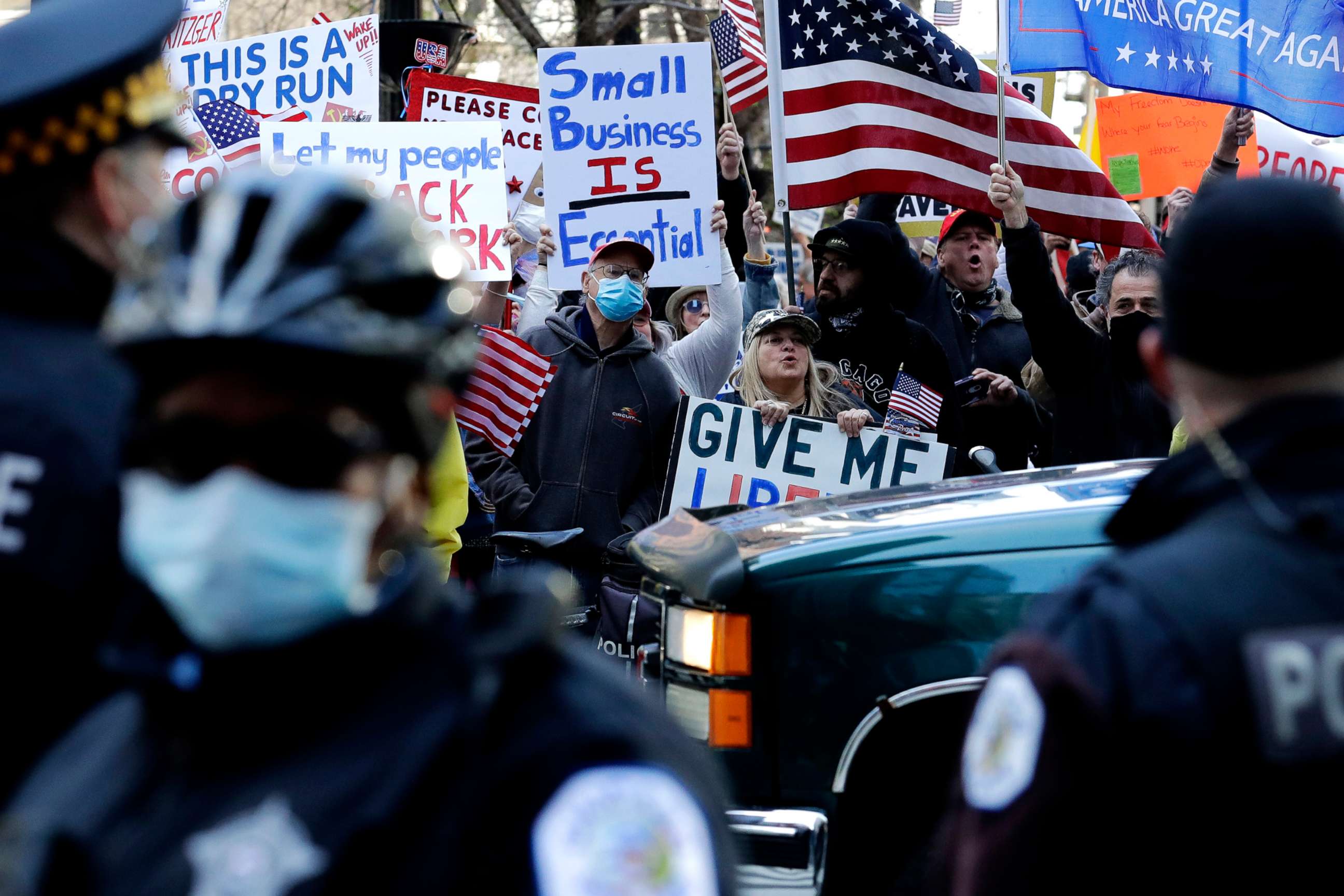 PHOTO: Demonstrators rally against Illinois stay-at-home order outside the Thompson Center in downtown Chicago, May 1, 2020. 