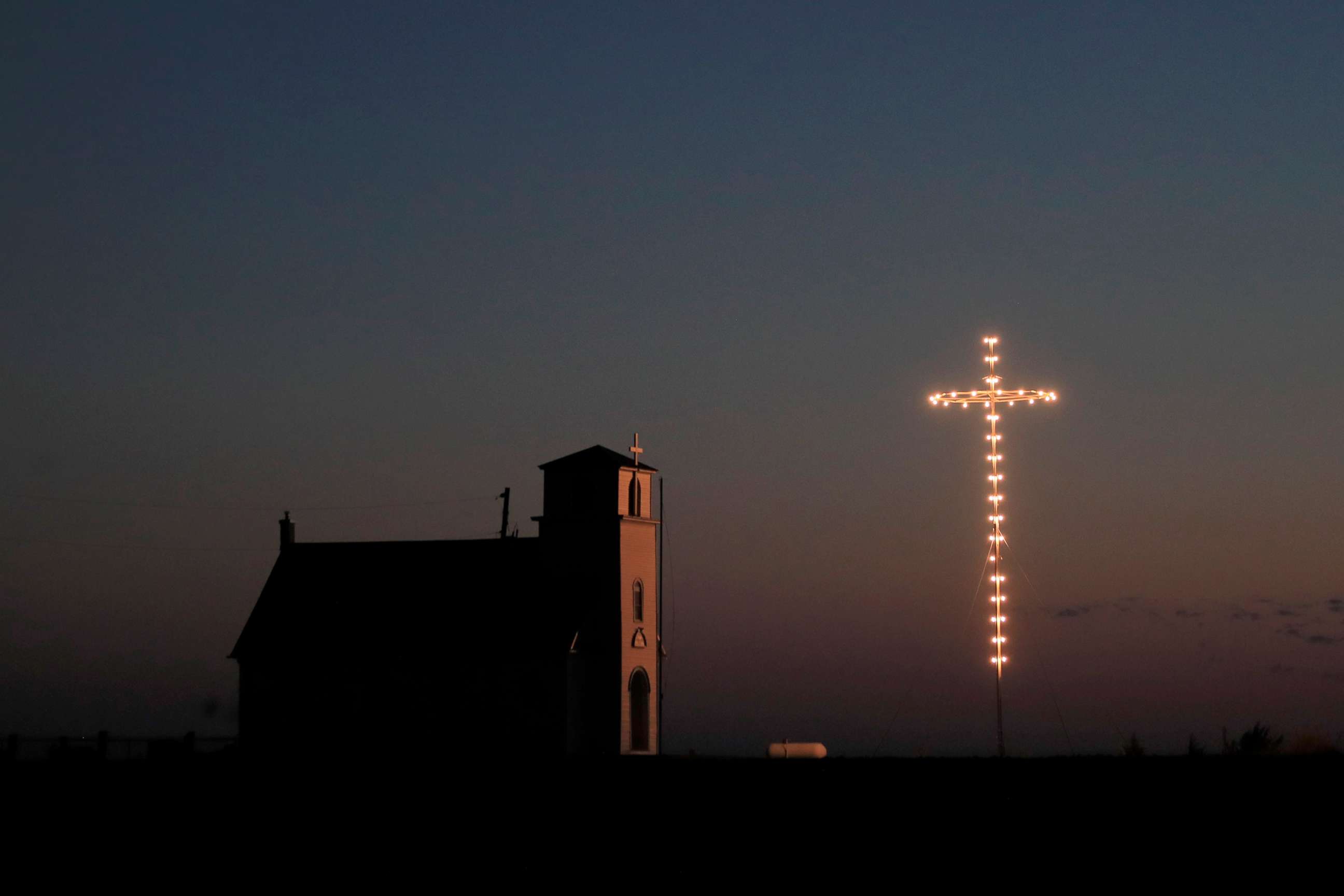 PHOTO: Known as The Lighted Cross Church, Excelsior Lutheran Church near Wilson, Kan., is dark, April 10, 2020. 