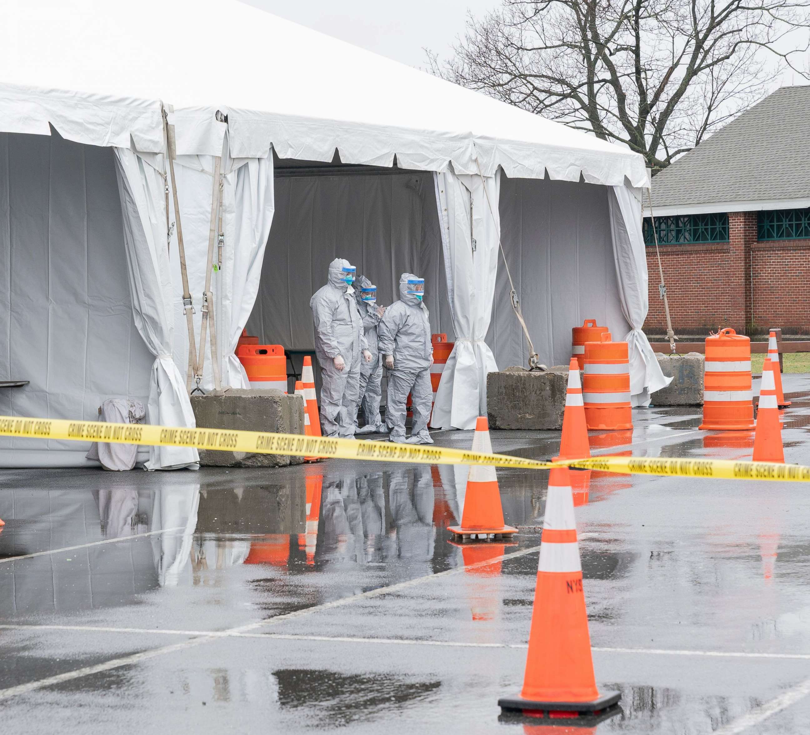 PHOTO:Workers in protective gear operate a drive through coronavirus mobile testing center organized by Northwell hospital at Glen Island Park in New Rochelle, New York, March 13, 2020.