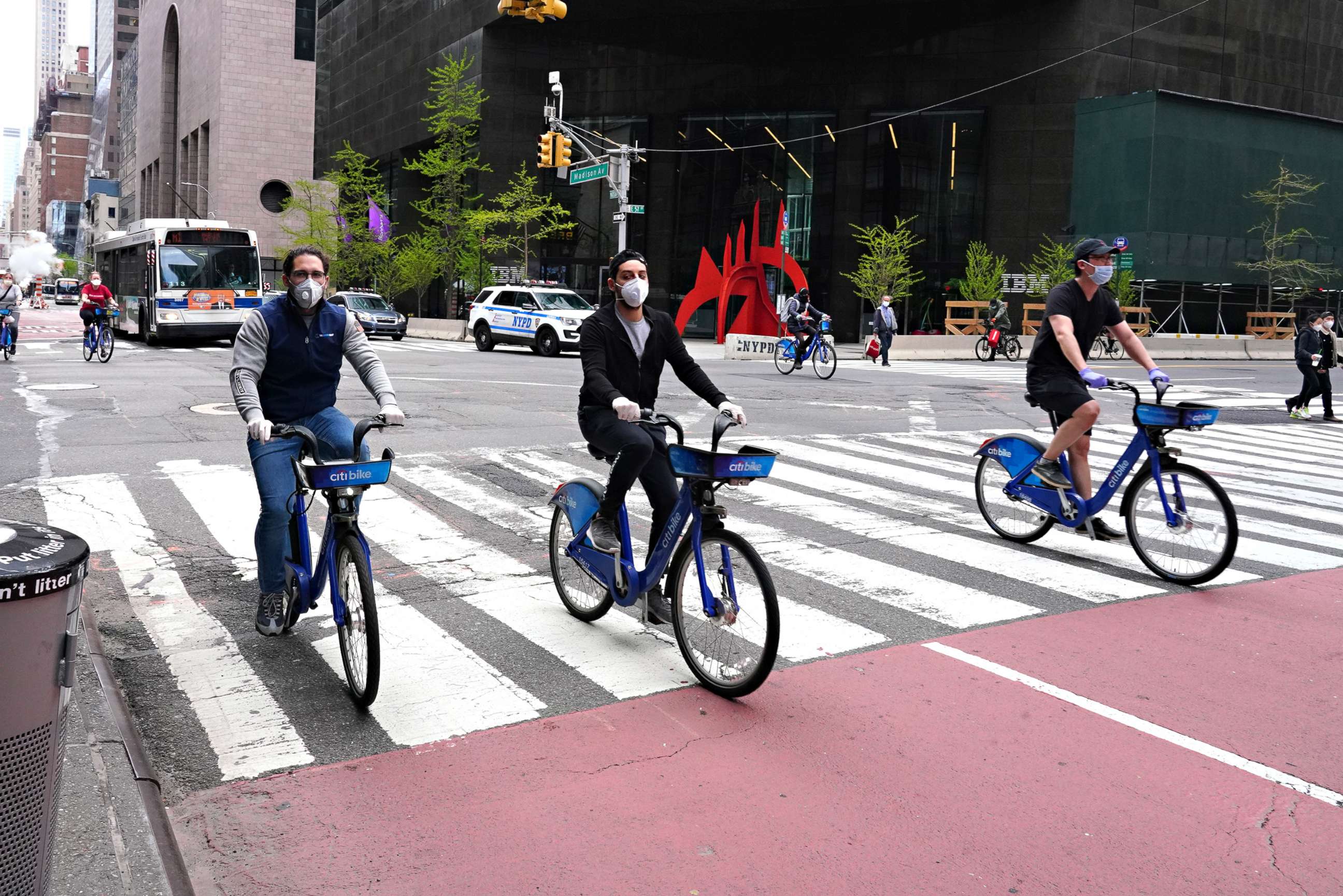 PHOTO: People wearing protective masks ride Citibikes during the coronavirus pandemic, April 19, 2020, in New York.