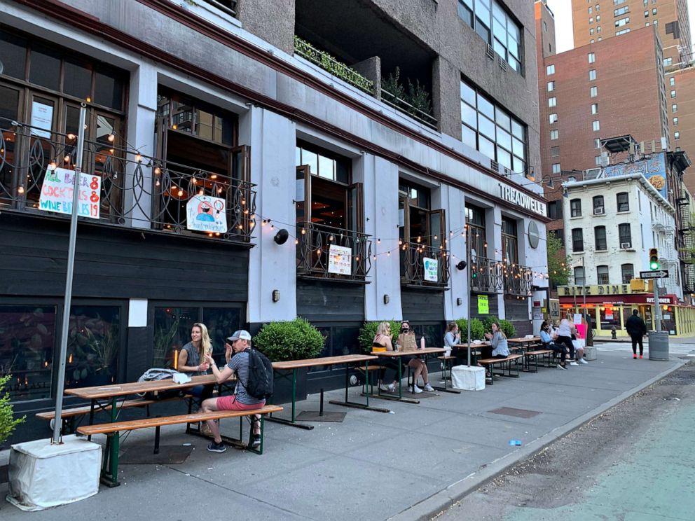 PHOTO: People drink cocktails outside a restaurant during the coronavirus pandemic, May 2, 2020, in New York.