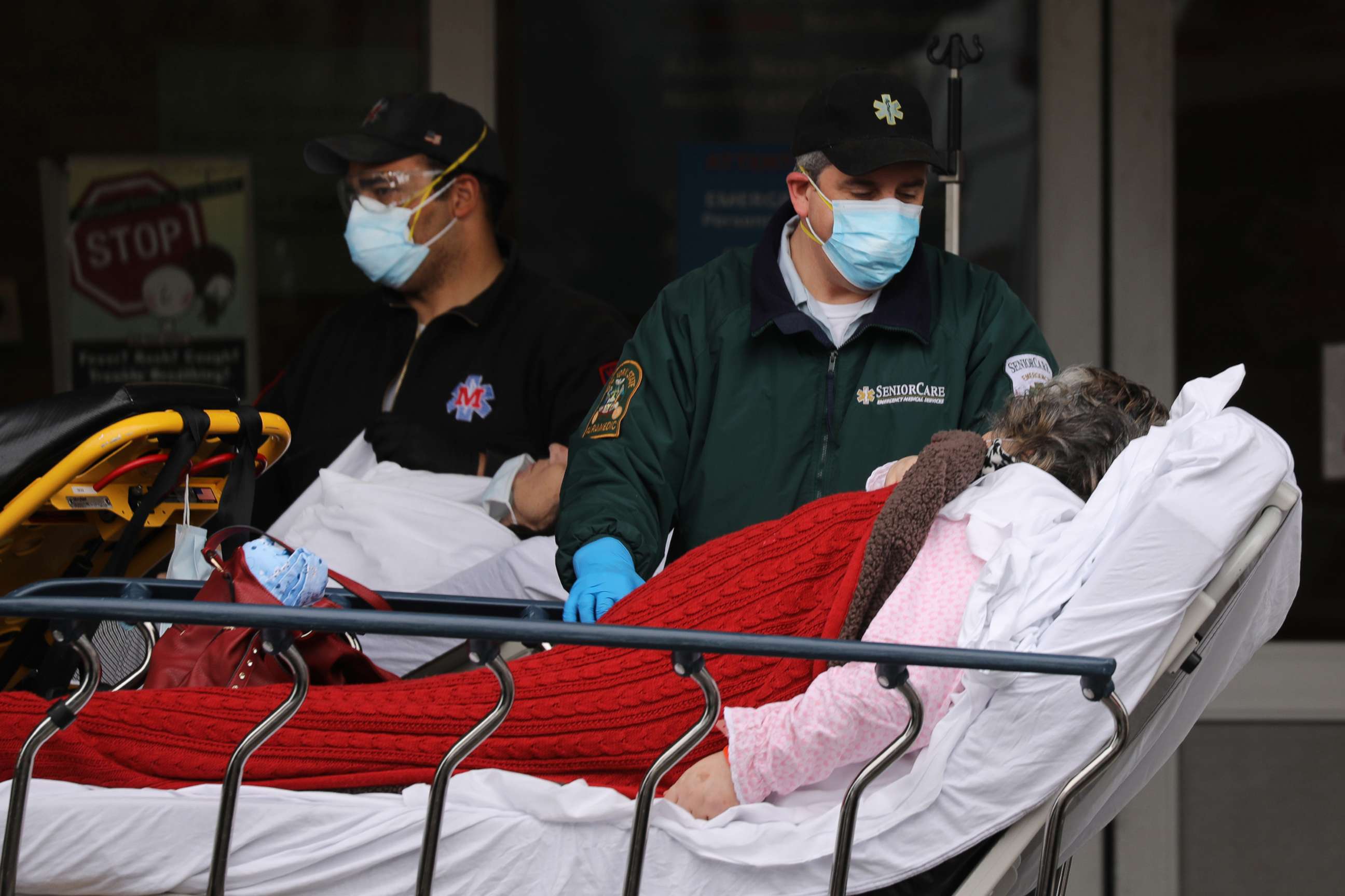 PHOTO: Medical workers transport a patient outside of a special coronavirus intake area at Maimonides Medical Center, April 20, 2020, in Brooklyn, New York.