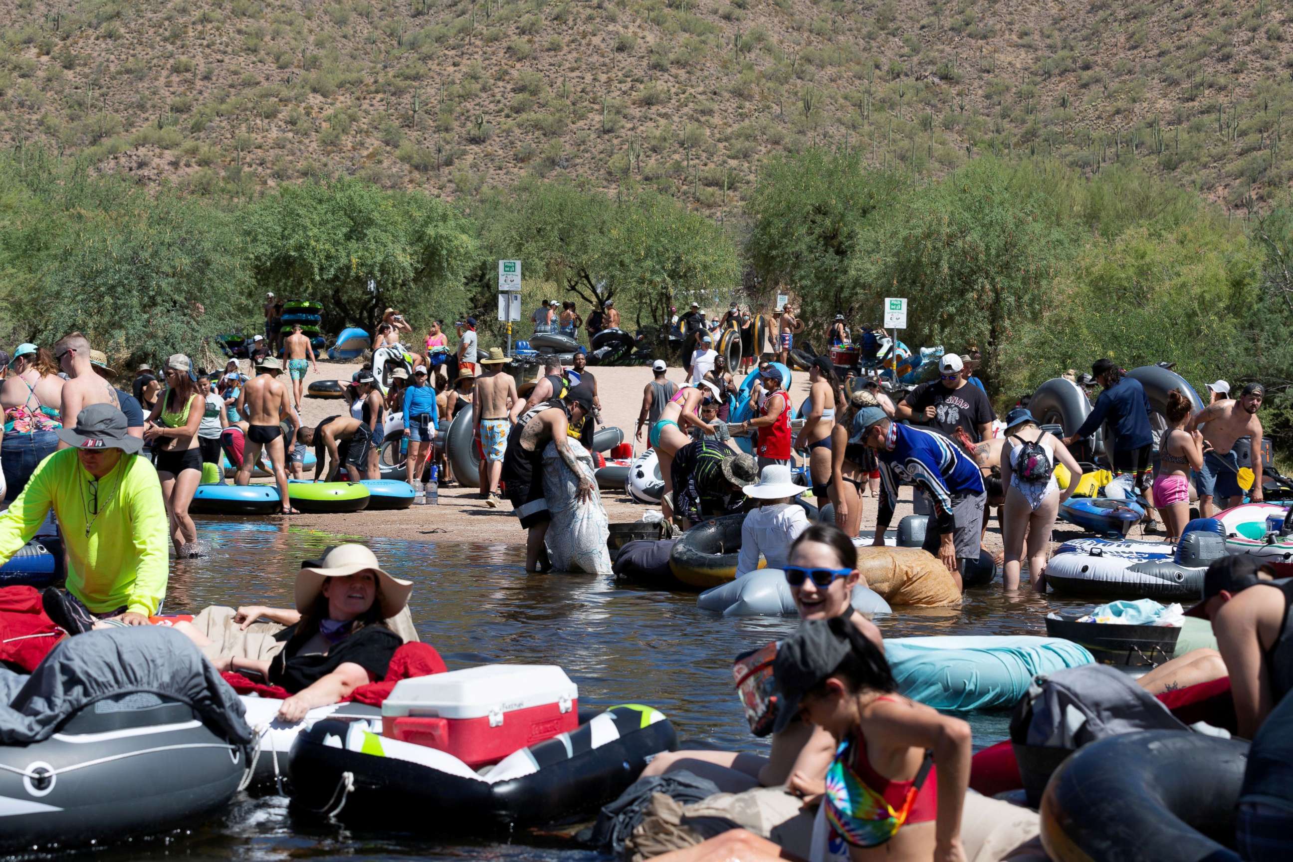PHOTO: People prepare to go tubing on Salt River amid the outbreak of the coronavirus disease (COVID-19) in Arizona, June 27, 2020.