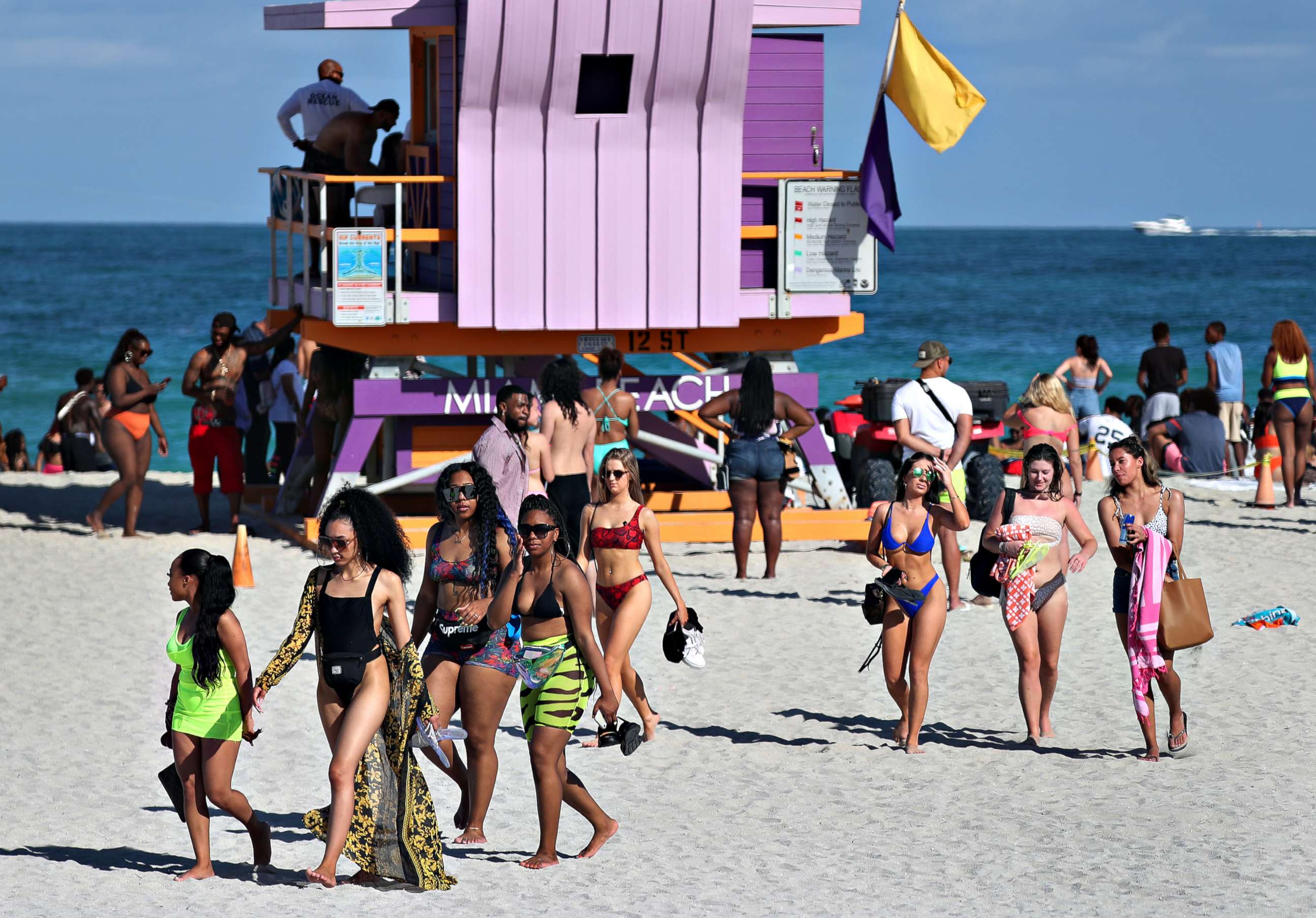 PHOTO: Beach goers make their way to the exit from South Beach as the city closes it in an effort to prevent the spread of the coronavirus, on March 15, 2020 in Miami Beach, Fla.