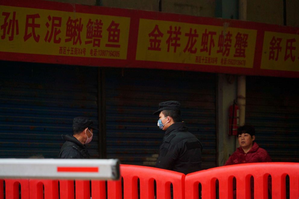 PHOTO: Police stand guard outside Wuhan Huanan Wholesale Seafood Market, where a number of people related to the market fell ill with a virus in Wuhan, China, Jan. 21, 2020.