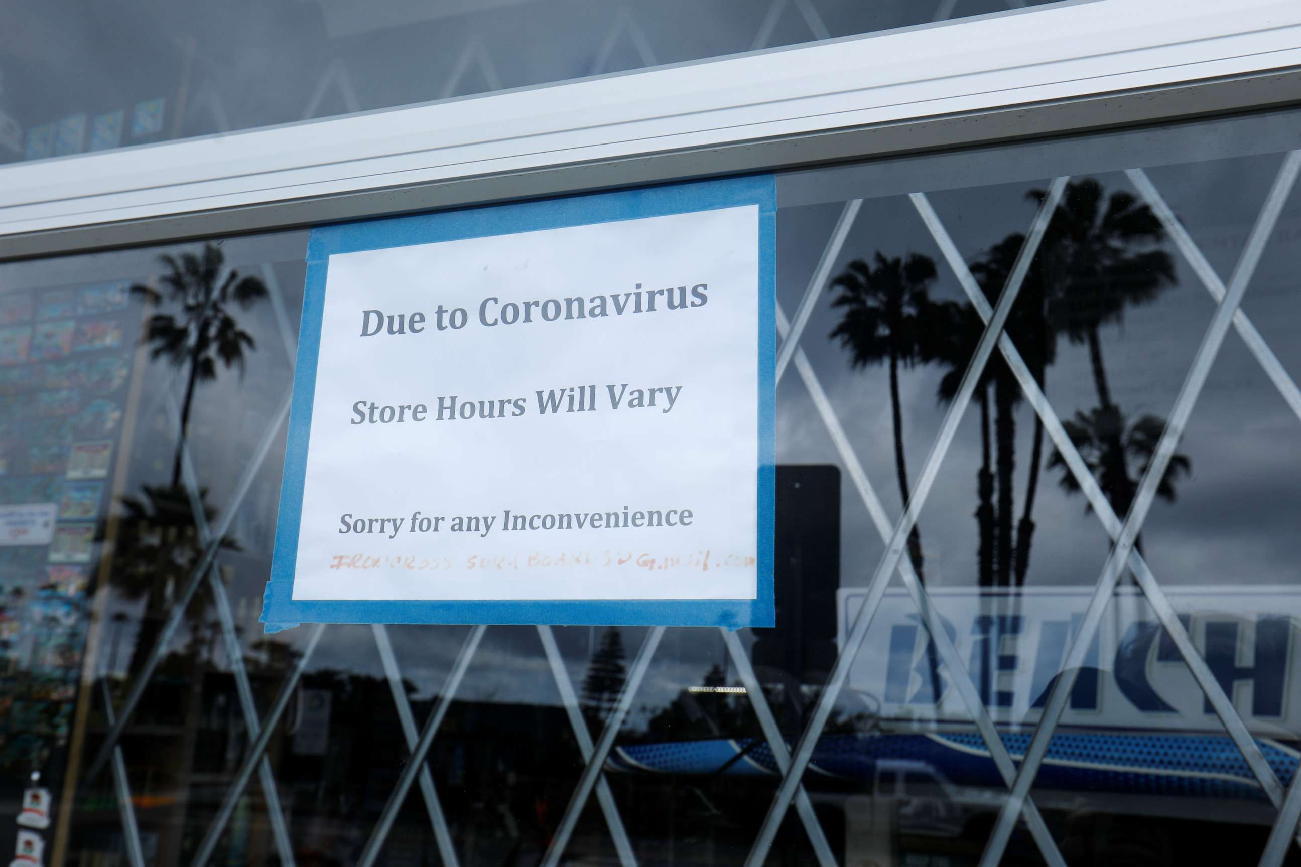 PHOTO: A closed sign is shown on the window of a beach sports store during the outbreak of the coronavirus in Encinitas, Calif., April 9, 2020.