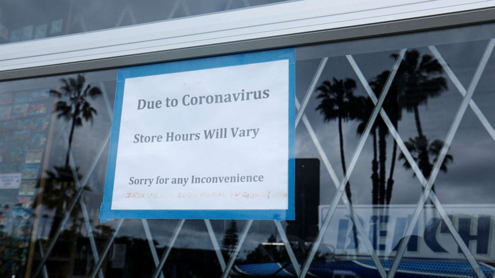PHOTO: A closed sign is shown on the window of a beach sports store during the outbreak of the coronavirus in Encinitas, Calif., April 9, 2020.
