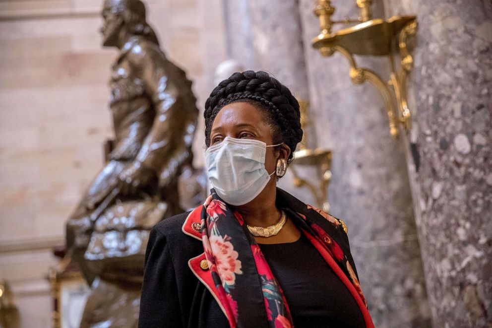 PHOTO: Rep. Sheila Jackson Lee wears a mask and speaks to a reporter as she walks towards the House Chamber on Capitol Hill, April 23, 2020, in Washington.