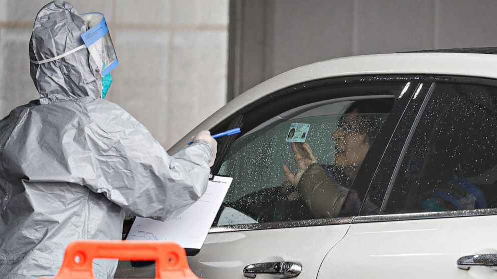 PHOTO: A driver arrives to be tested for the coronavirus at Glen Island Park in New Rochelle, New York on March 13, 2020. 