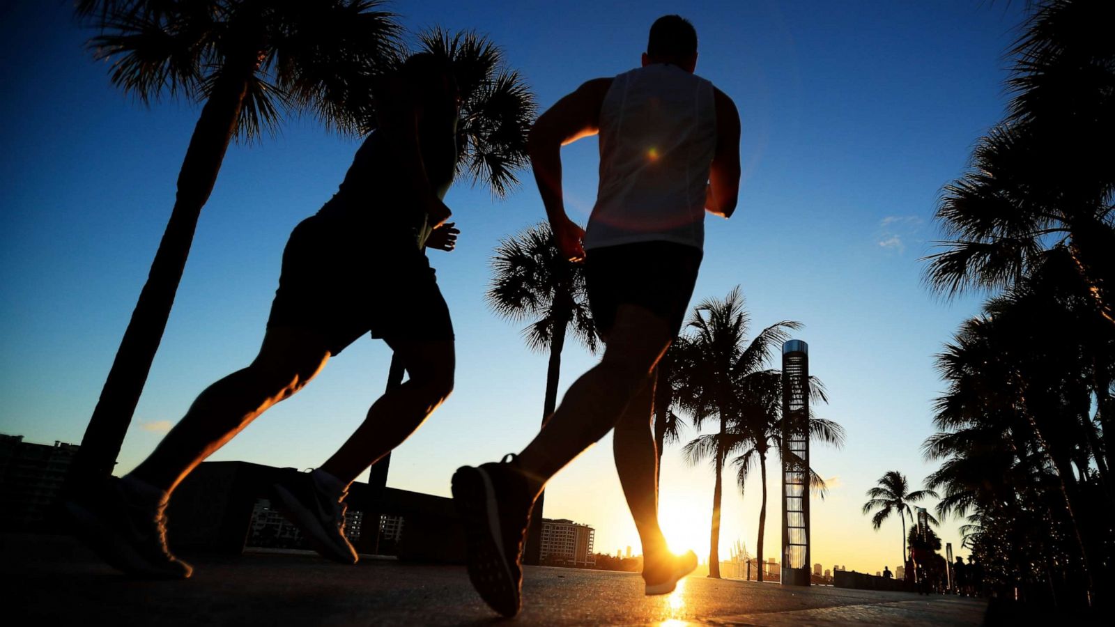 PHOTO: MIAMI BEACH, FL - MARCH 18: People exercise in South Pointe Park in Miami Beach, Florida. Miami Beach city officials closed the area of the beach that is popular with college spring breakers and asked them to refrain from large gatherings.