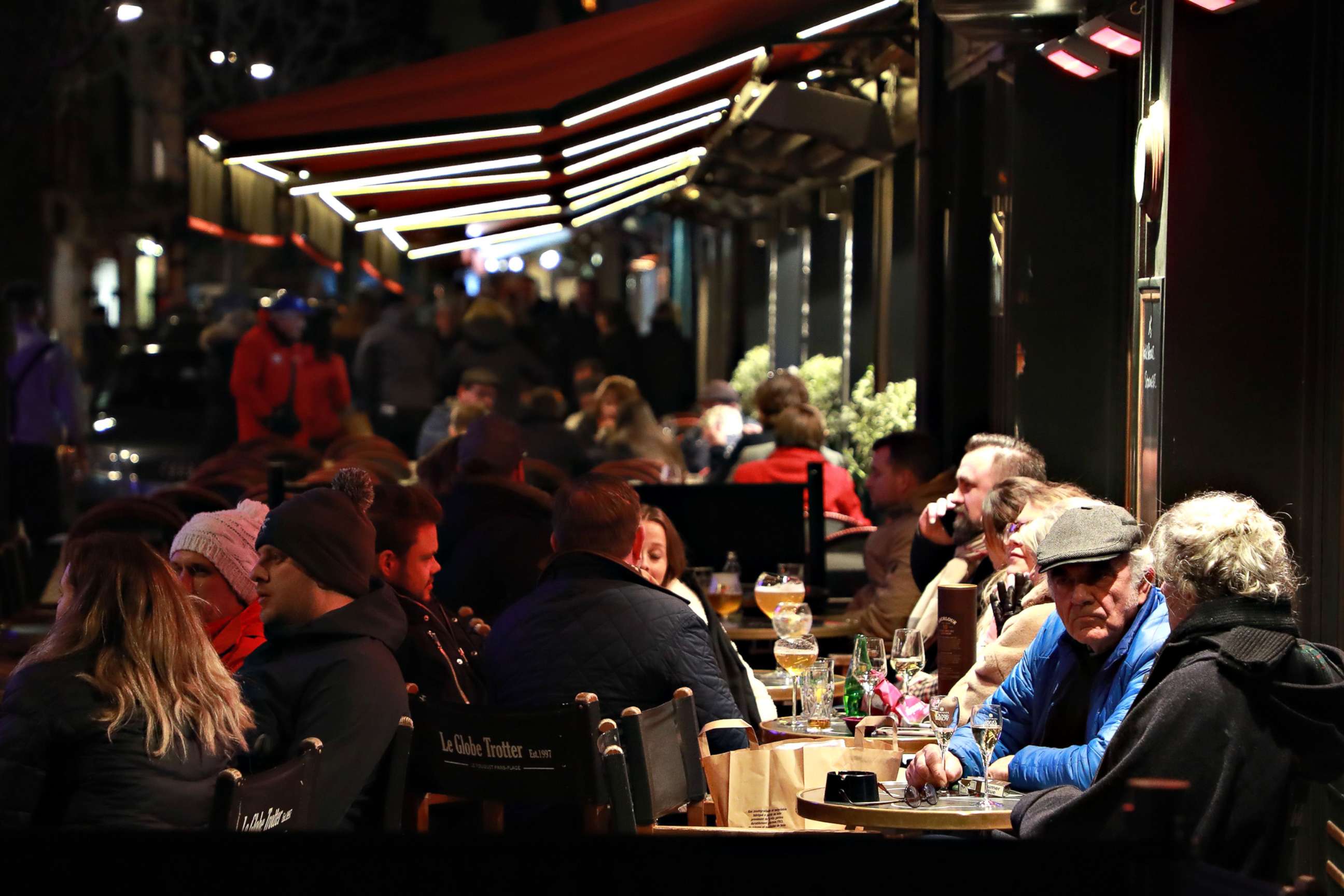 PHOTO: People gather at a cafe's terrace in Le Touquet, France, ahead of the closure of all non-essential public places to contain the coronavirus, on March 14, 2020.