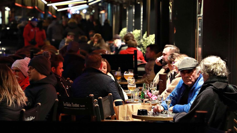 PHOTO: People gather at a cafe's terrace in Le Touquet, France, ahead of the closure of all non-essential public places to contain the coronavirus, on March 14, 2020.