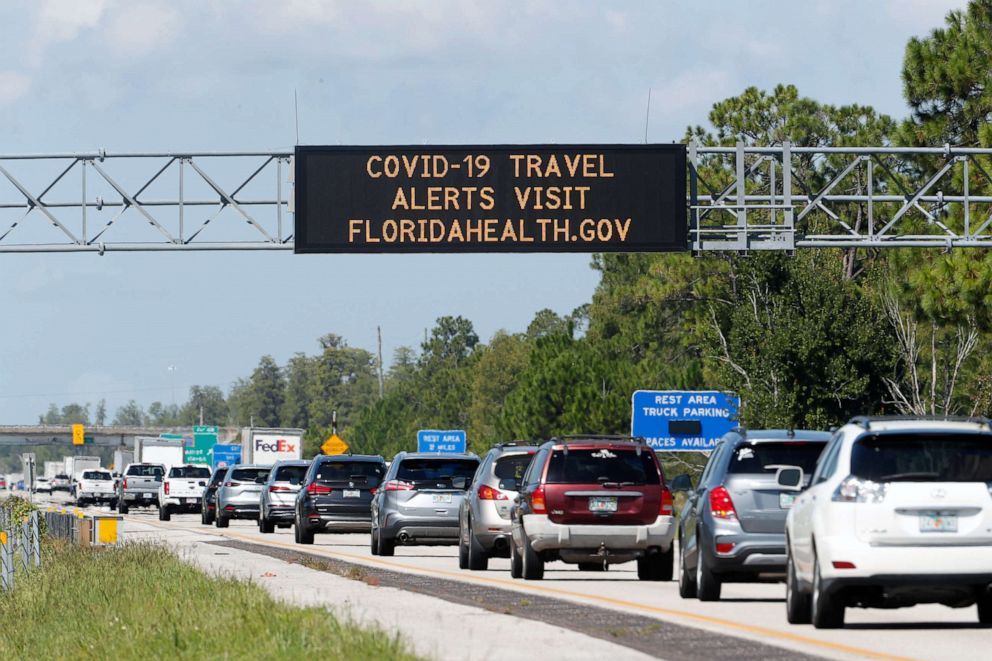 PHOTO: A COVID-19 sign alerting drivers to visit FLORIDAHEALTH.GOV during their commute on Interstate I-4 on Aug. 14, 2020 in Kissimmee, Fla.