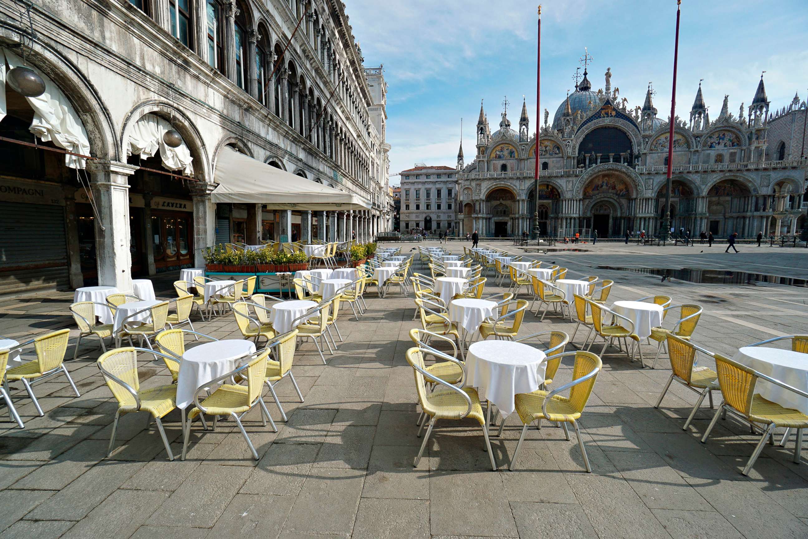 PHOTO: Empty chairs and tables are lined up outside a restaurant in St. Mark's Square in Venice, Italy, March 9, 2020.