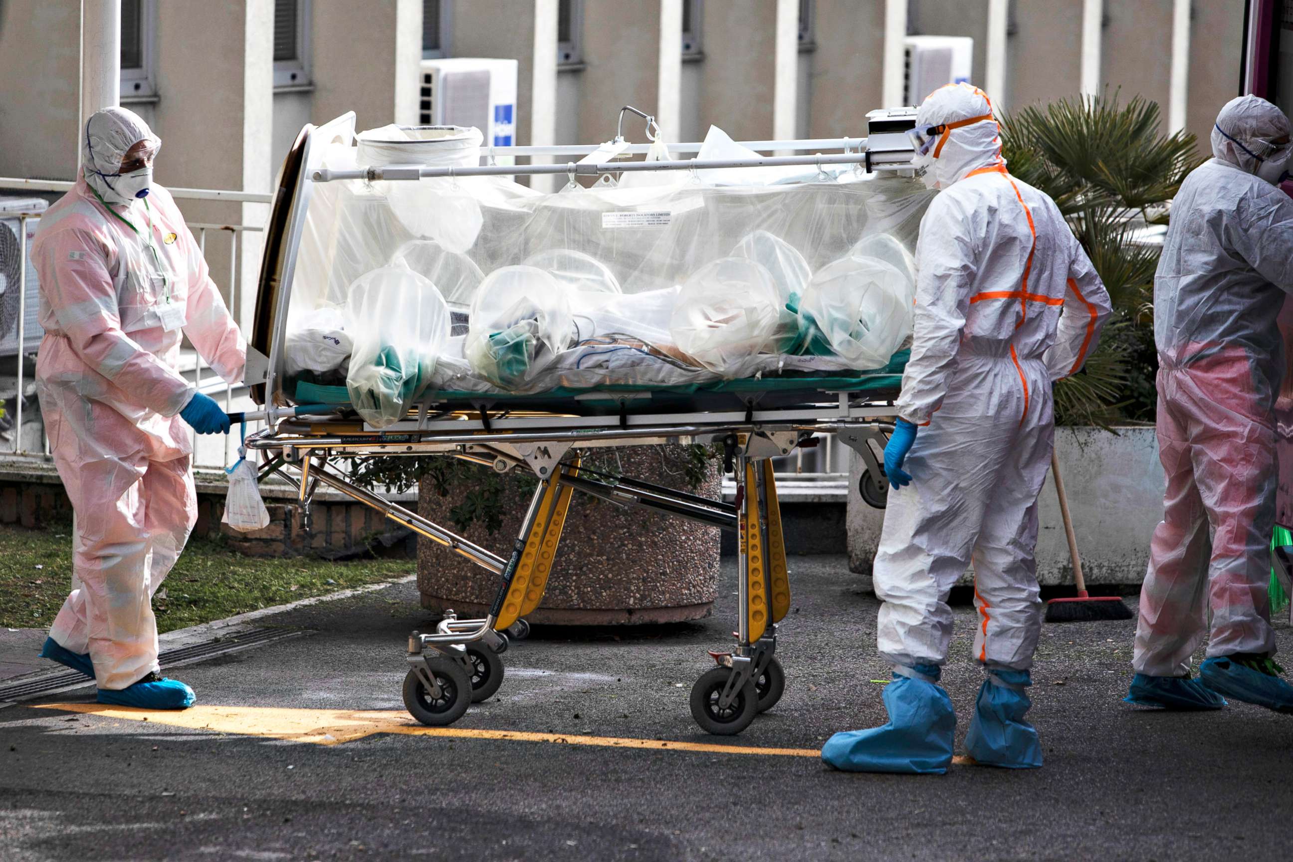 PHOTO: Paramedics transport a patient, suspected to have the coronavirus, to a hospital in Rome, March 17, 2020.