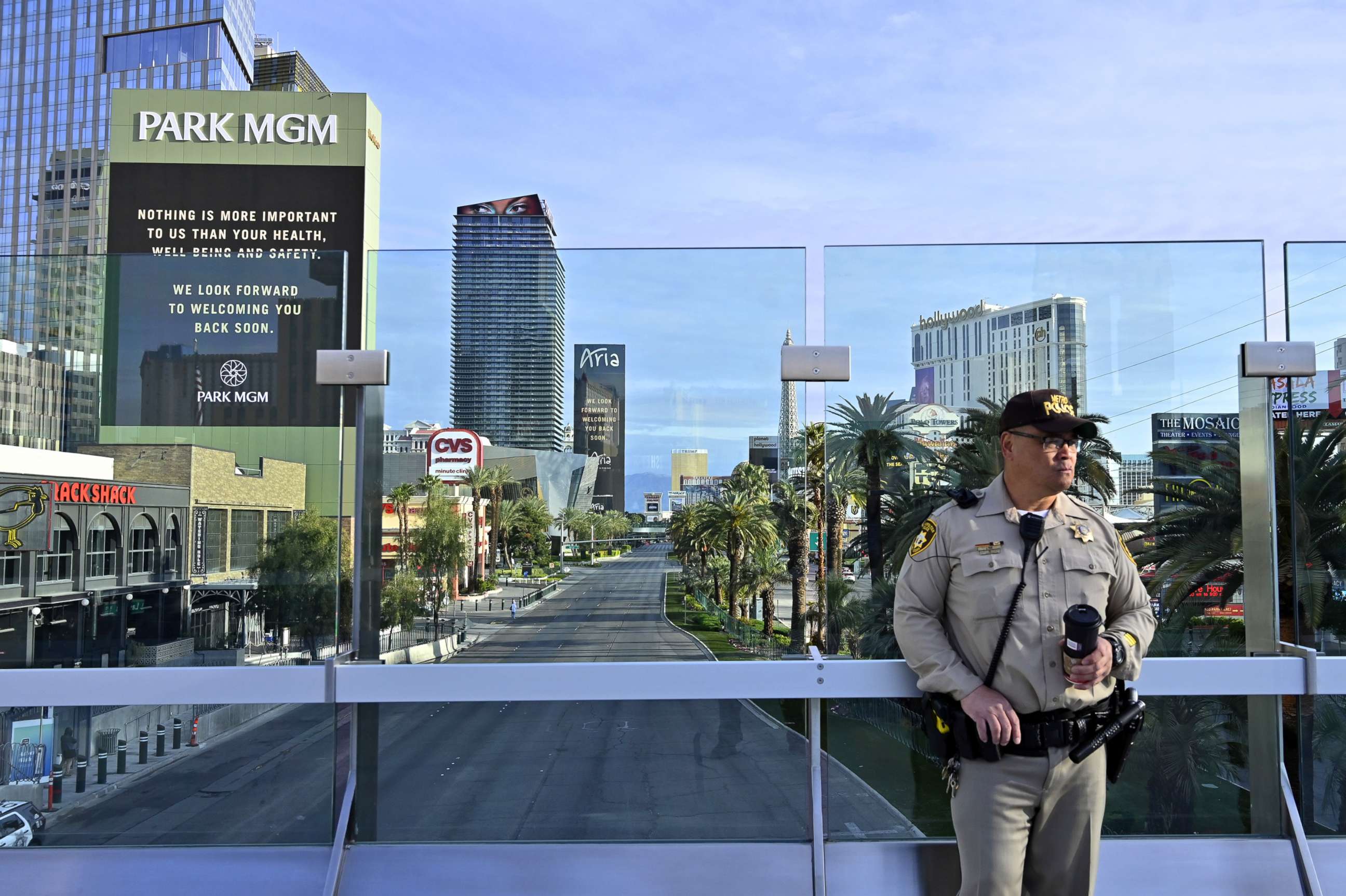PHOTO: Las Vegas police officer Jimmy Ruiz patrols a pedestrian overpass over the nearly deserted Las Vegas Strip, amid the coronavirus pandemic, in Las Vegas, March 21, 2020.