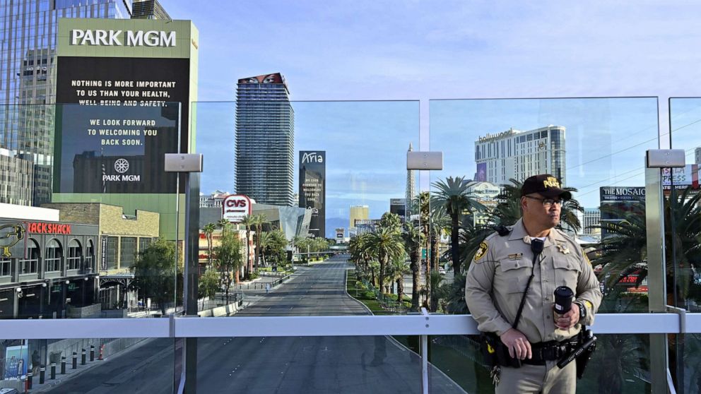 PHOTO: Las Vegas police officer Jimmy Ruiz patrols a pedestrian overpass over the nearly deserted Las Vegas Strip, amid the coronavirus pandemic, in Las Vegas, March 21, 2020.