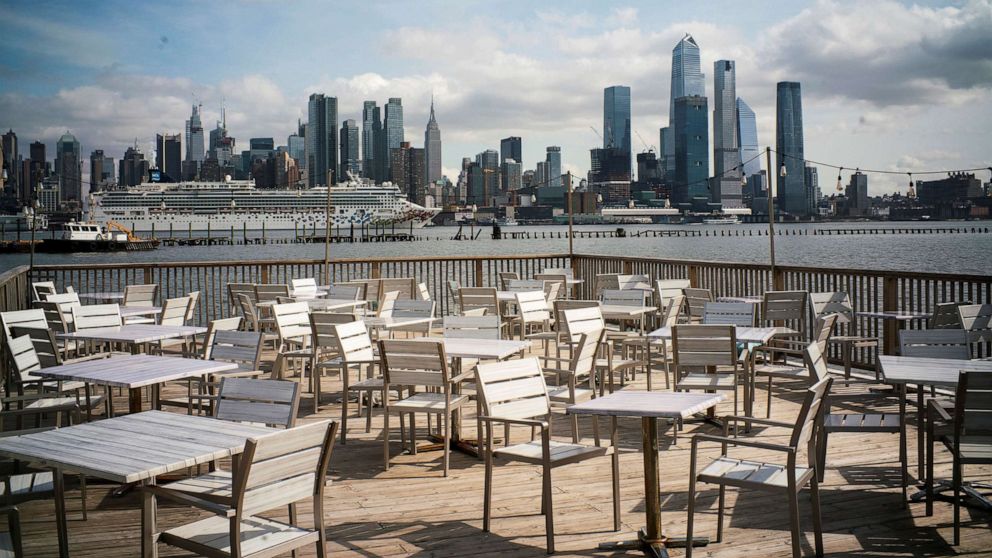 PHOTO: Empty chairs are seen at the deck of a local restaurant that is closed due to the outbreak of coronavirus disease (COVID-19), in Hoboken, N.J., March 16, 2020.