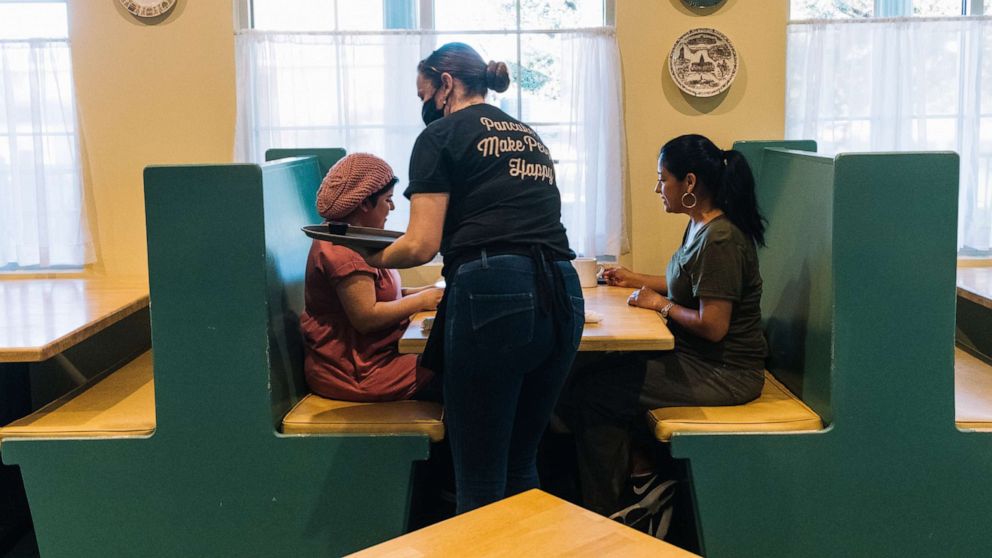 PHOTO: Customers are served at Magnolia Pancake Haus in San Antonio, Texas, May 1, 2020.