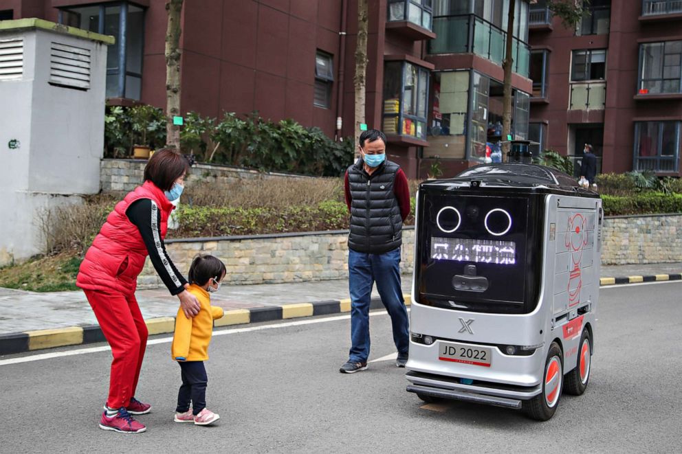 PHOTO: The intelligent distribution robot is sending packages 'contactlessly' during the COVID-19 outbreak in Guiyang, Guizhou, China on Feb. 26, 2020.