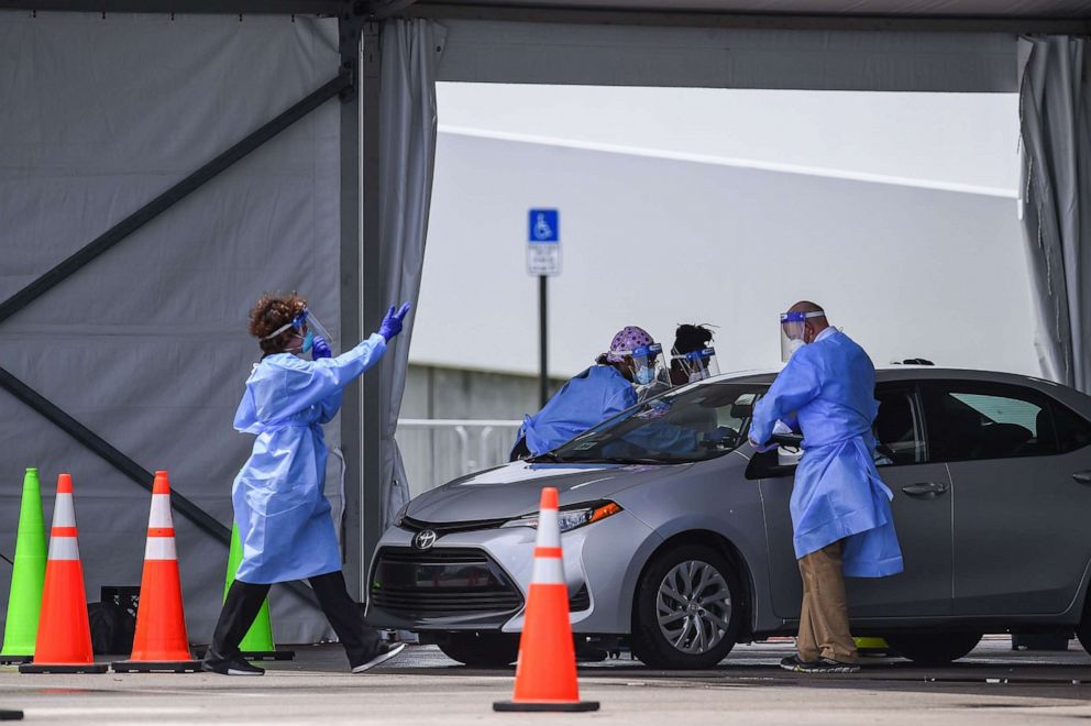 PHOTO: Medical staff prepare to administer rapid antigen COVID-19 tests at Hard Rock Stadium in Miami Gardens near Miami, Florida, on Aug. 5, 2020.