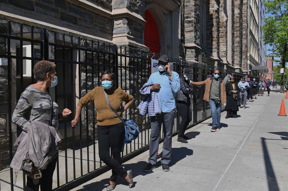 PHOTO: Residents wait in line to get tested for COVID-19 antibodies at Abyssinian Baptist Church in the Harlem neighborhood of New York, May 14, 2020.