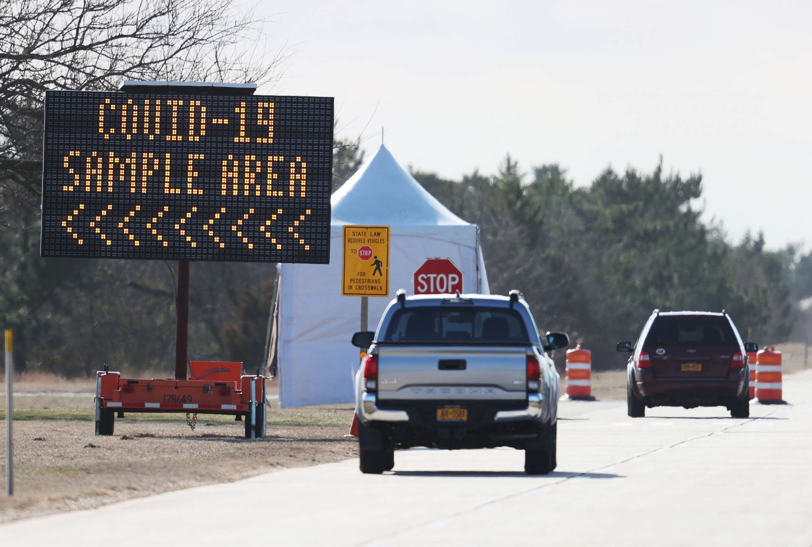 PHOTO: Cars arrive at a coronavirus drive-thru testing site at the Theodore Roosevelt Nature Center, on March 17, 2020, at Jones Beach State Park, New York.