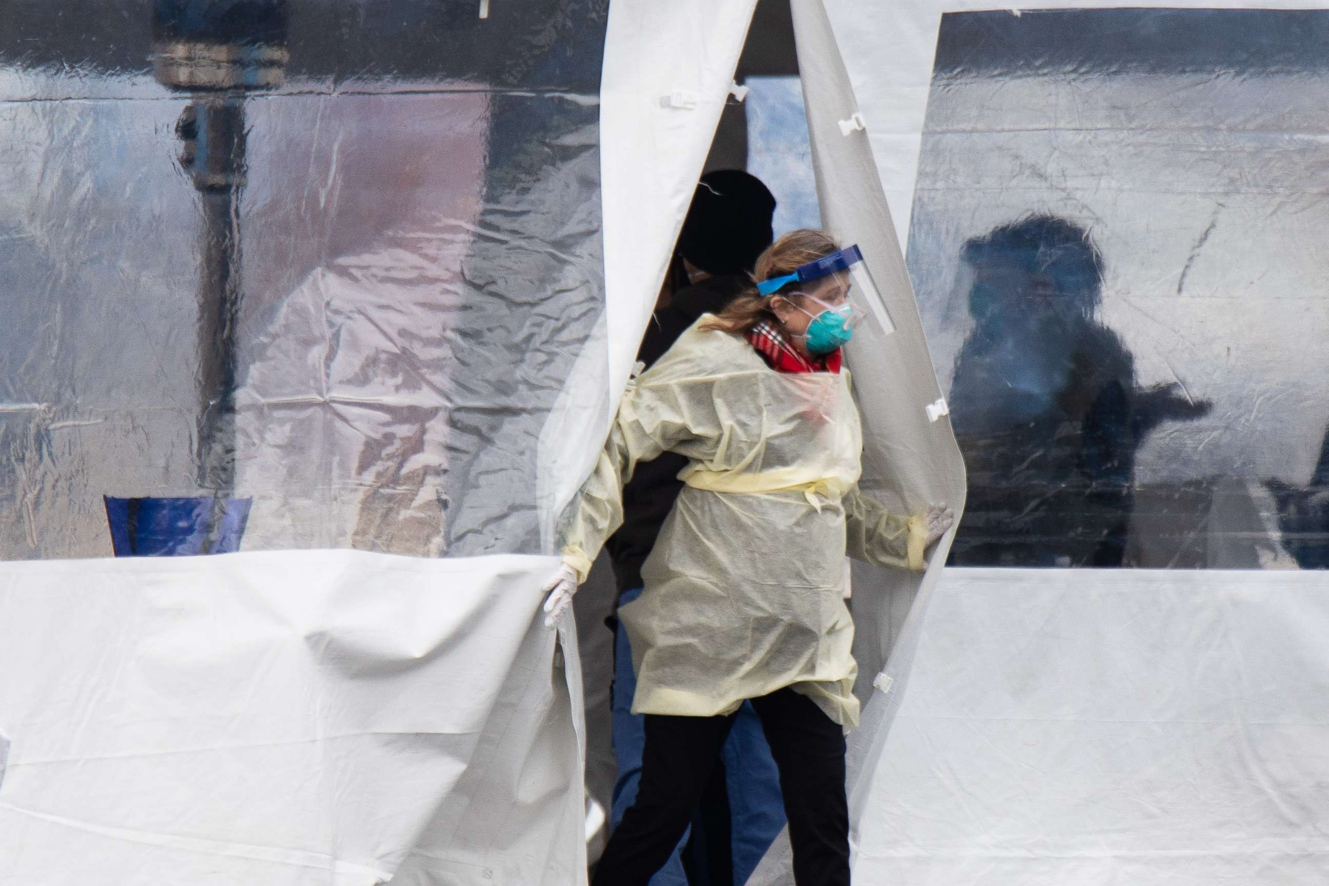 PHOTO: A health professional walks out of a drive-through coronavirus testing site at the University of Dayton in Dayton, Ohio, on March 17, 2020.