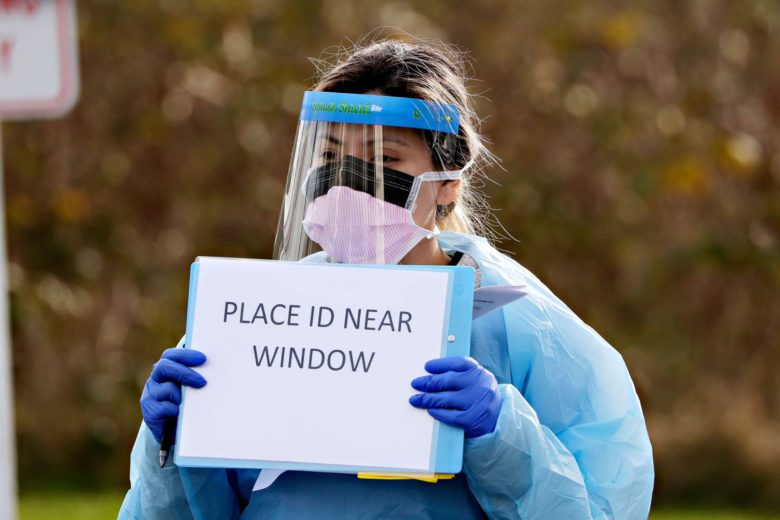 PHOTO:Medical assistant Miriam Fuentes gives a patient instructions via at a drive-through COVID-19 coronavirus testing station for University of Washington Medicine patients, March 17, 2020, in Seattle. 