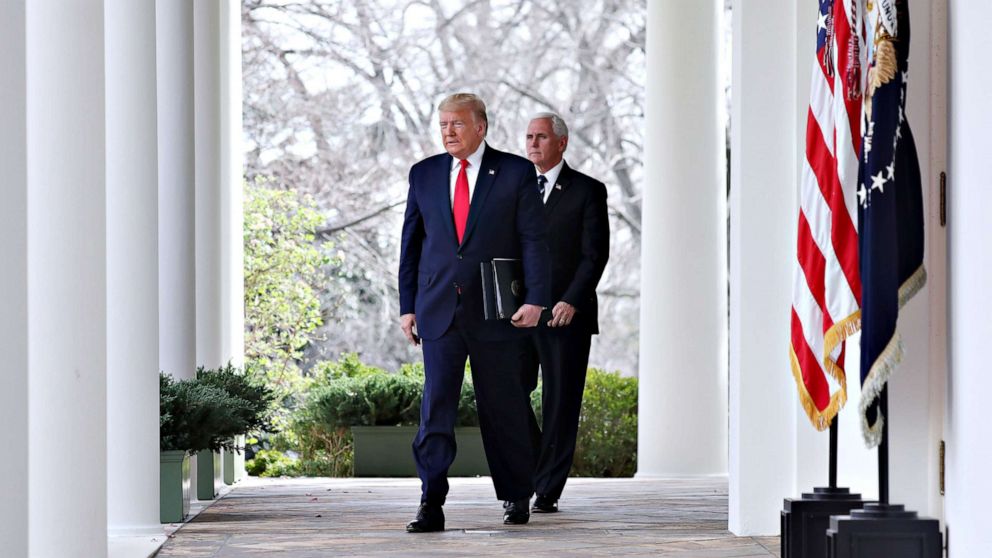 PHOTO: President Donald Trump arrives with Vice President Mike Pence to declare a national emergency due to the COVID-19 coronavirus pandemic, in the Rose Garden of the White House, in Washington, March 13, 2020.