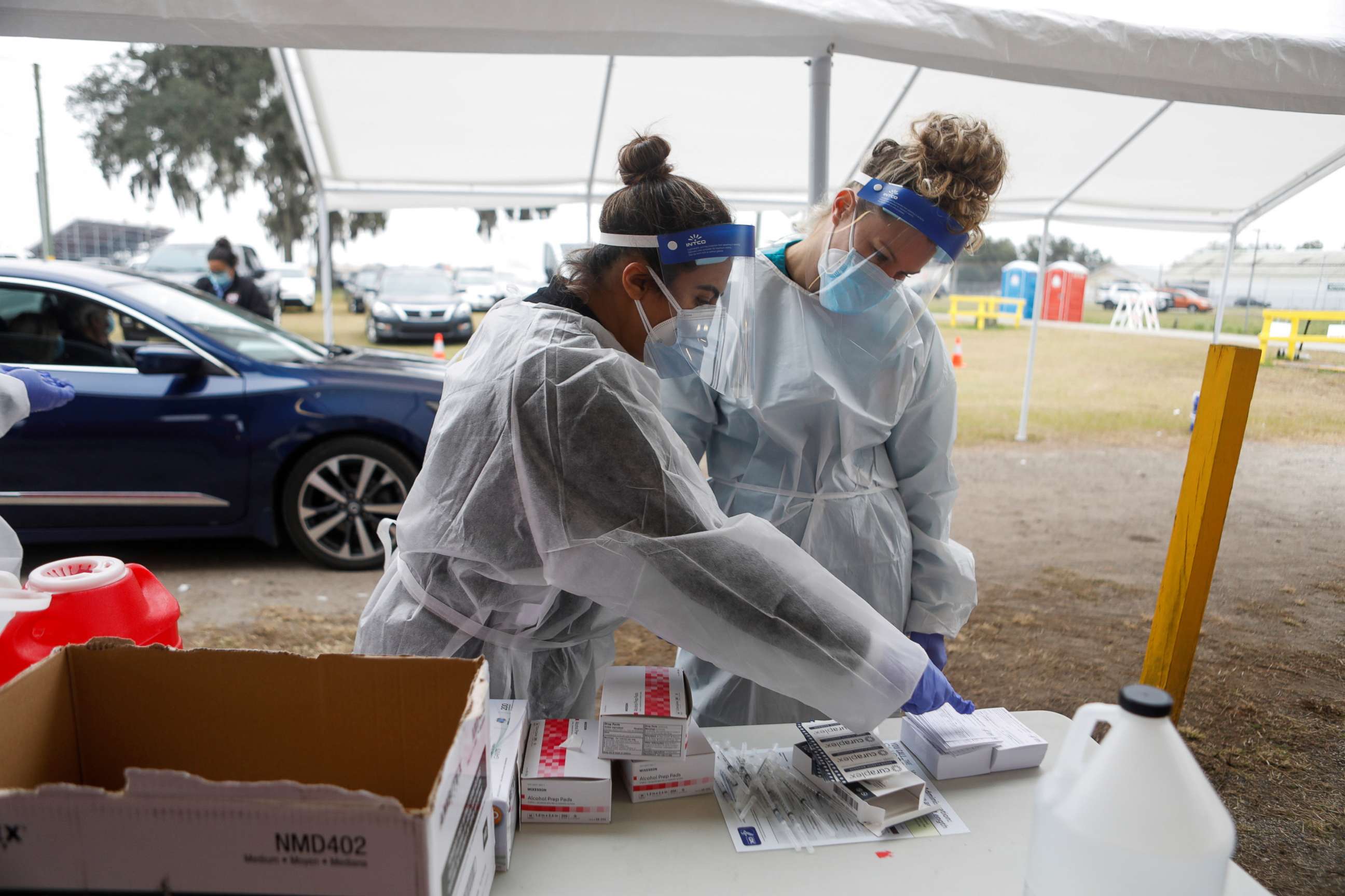 PHOTO: Medical workers prepare to administer Pfizer-BioNTech COVID-19 vaccines at a drive-through COVID-19 vaccination site at the Strawberry Festival Fairgrounds in Plant City, Fla., Jan. 13, 2021.