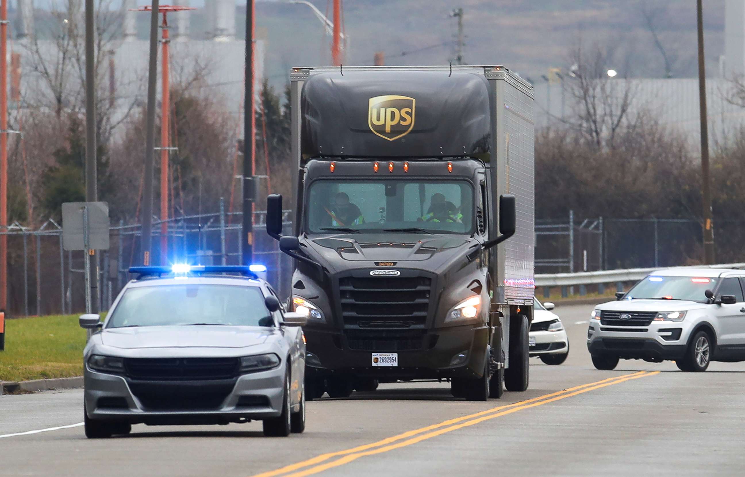 PHOTO: Kentucky State Police escort a UPS truck carrying Moderna's COVID-19 vaccine as it arrives at UPS Worldport, in Louisville, Dec. 20, 2020.