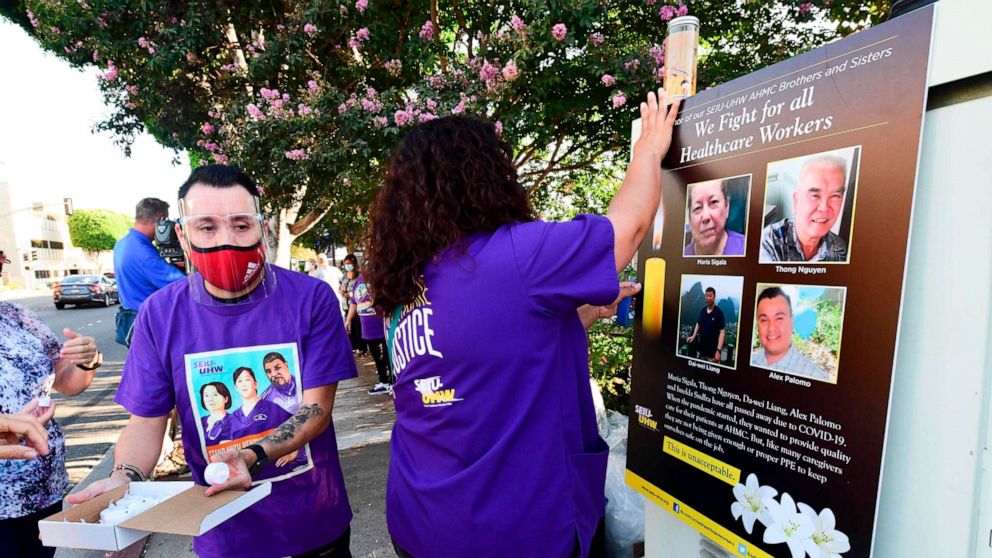 PHOTO: Photographs of some of the health care workers who died from COVID-19 are displayed during a vigil in Alhambra, California, on Sept. 1, 2020.