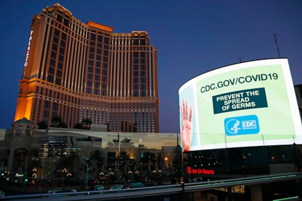 PHOTO: A sign advises people to minimized the spread of germs, along the Las Vegas Strip devoid of the usual crowds during the coronavirus outbreak, May 26, 2020, in Las Vegas. 