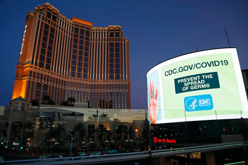 PHOTO: A sign advises people to minimized the spread of germs, along the Las Vegas Strip devoid of the usual crowds during the coronavirus outbreak, May 26, 2020, in Las Vegas. 
