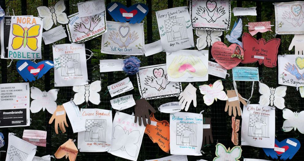 PHOTO: Tributes to lost love ones adorn a fence outside Brooklyn's Green-Wood Cemetery where many victims of COVID-19 are buried, May 28, 2020 in New York.