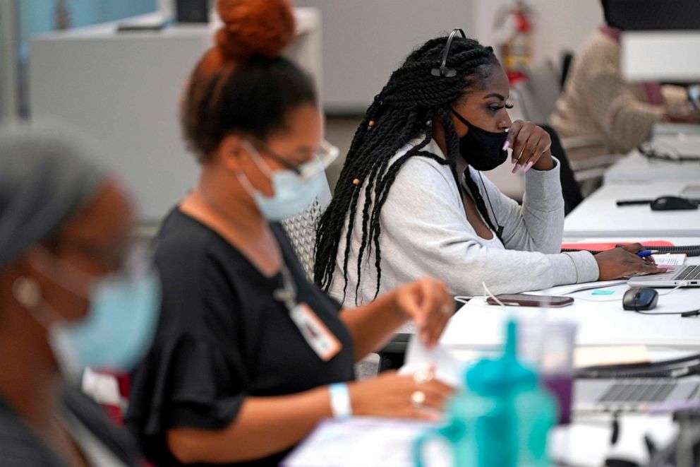 PHOTO: Contact tracer Kandice Childress, right, works at Harris County Public Health contact tracing facility, June 25, 2020, in Houston.