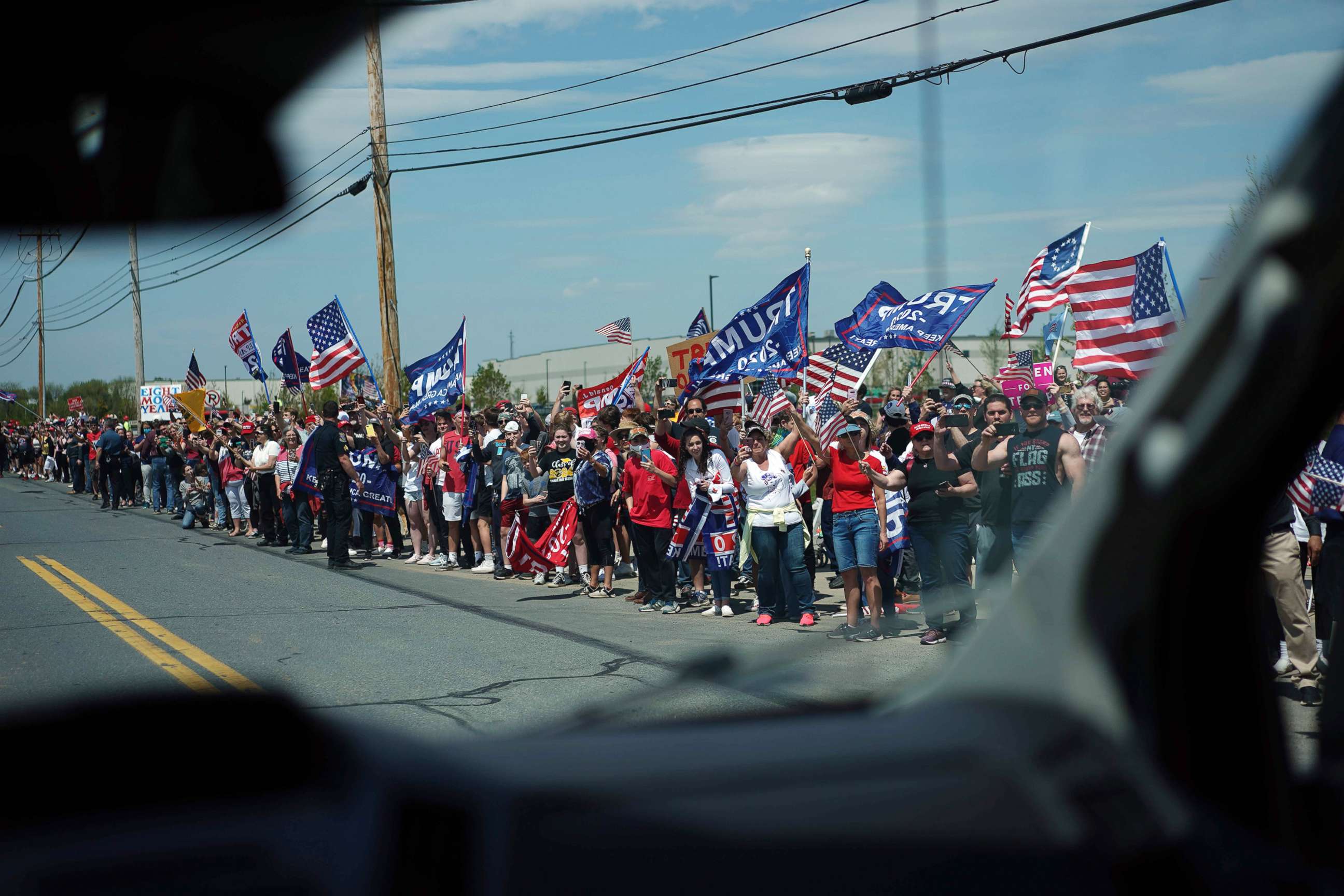 PHOTO: Trump supporters hold signs before President Donald Trump visits medical supply distributor Owens and Minor Inc. in Allentown, Pa., on May 14, 2020.