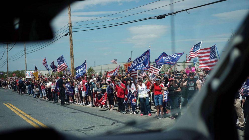 PHOTO: Trump supporters hold signs before President Donald Trump visits medical supply distributor Owens and Minor Inc. in Allentown, Pa., on May 14, 2020.