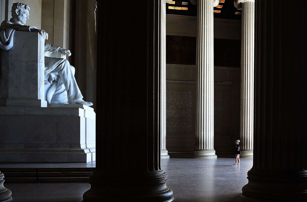 PHOTO: A woman visits the Lincoln Memorial on the National Mall on April 2, 2020 in Washington, D.C.