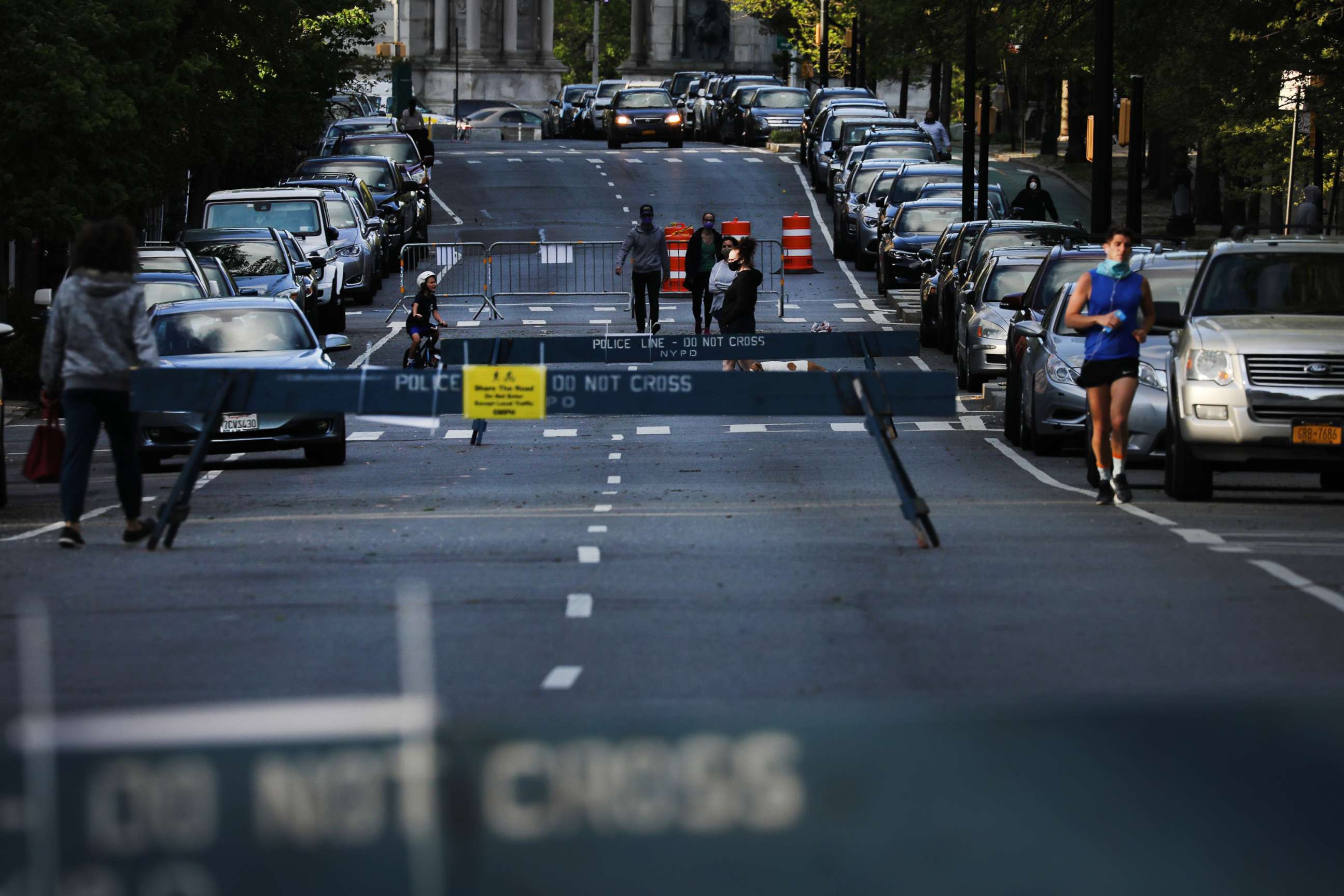 PHOTO: People walk along a street closed to vehicle traffic as the city expands areas for pedestrians to walk and to keep a recommended safe distance on May 4, 2020 in New York City.